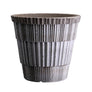 Hand crafted textured terracotta plant pot with speckled gray glaze, white background