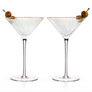 Pair of Deco Gold Rimmed Martini Glasses with ribbed crystal, each garnished with two olives on a skewer, shown on a white background.