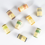 Assorted colors of Nutscene mini twine spools on a white background