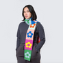 Women wearing Skinny Knit Scarf, Flower Block Rainbow pattern