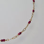 Tuvana Necklace with Rubies, ruby & gold link chain necklace, close up