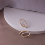 palette post earrings, brass wire earrings shaped like painter's palette on white background