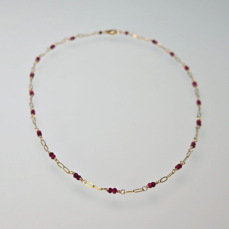 Tuvana Necklace with Rubies on a light gray background