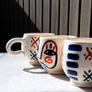 Visage Mug